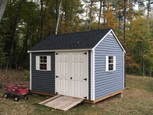 Vinyl-sided shed built for a Dover NH homeowner with clean lines, balanced proportions, and durable New Hampshire craftsmanship.